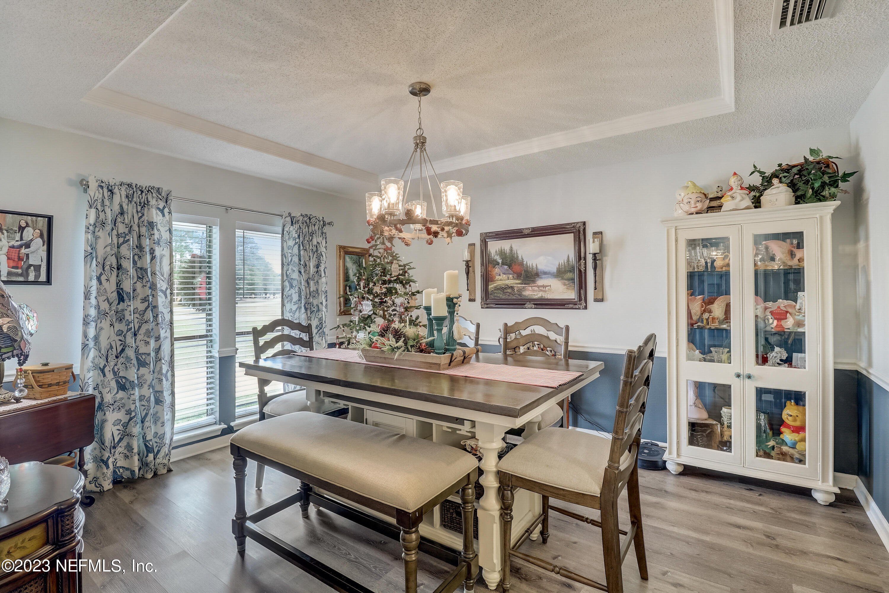 55377 Deer Run Road Callahan, FL 32011 - Photo 7 of 47 a dining room with furniture a chandelier and wooden floor