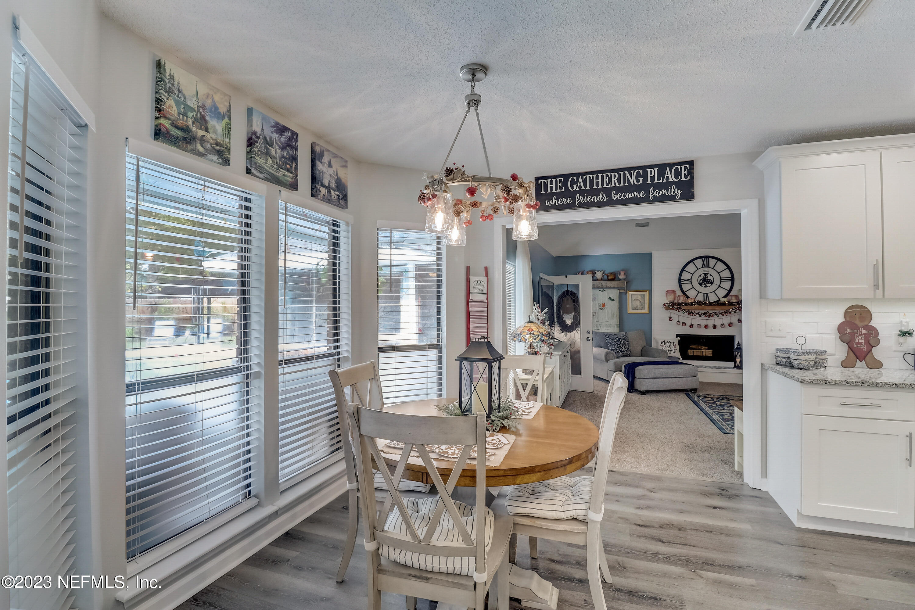 55377 Deer Run Road Callahan, FL 32011 - Photo 9 of 47 a view of a dining room with furniture window and wooden floor