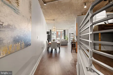 a dining room with furniture and wooden floor