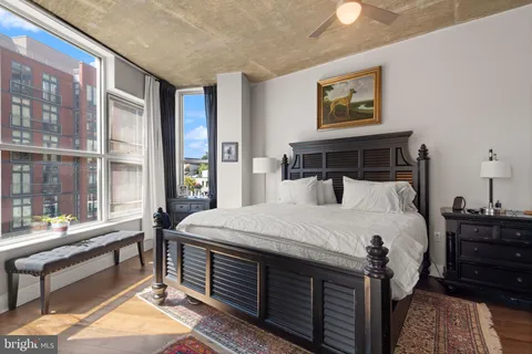 a bed room with a bed and a chair