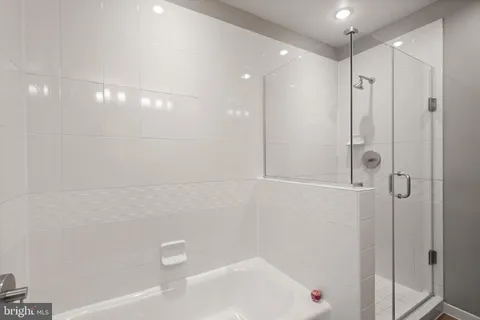 a white toilet sitting next to a bathroom sink