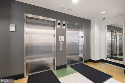 a bathroom with a shower and a mirror