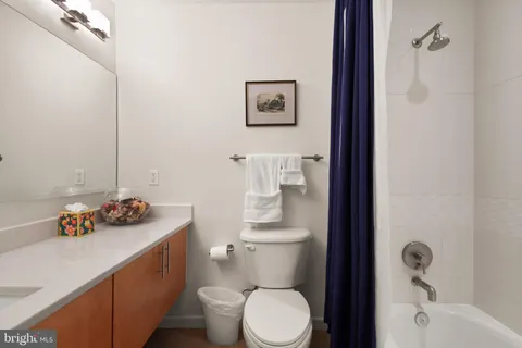 a bathroom with a sink toilet and vanity