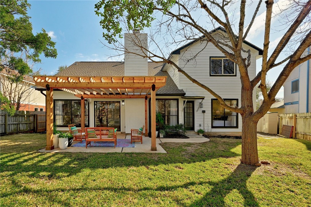 a front view of a house with a yard table and chairs