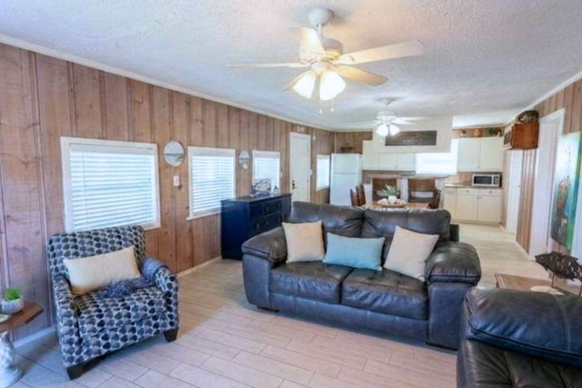 959 South East Road Crystal Beach, TX 77650 - Photo 11 of 20 a living room with furniture and a large window