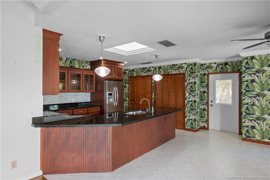 969 Southeast St Lucie Boulevard Stuart, FL 34996 - Photo 11 of 49 a dinning room with a table and chairs