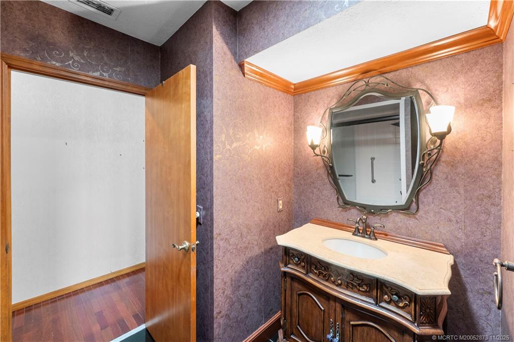 969 Southeast St Lucie Boulevard Stuart, FL 34996 - Photo 19 of 49 a bathroom with a sink and a mirror