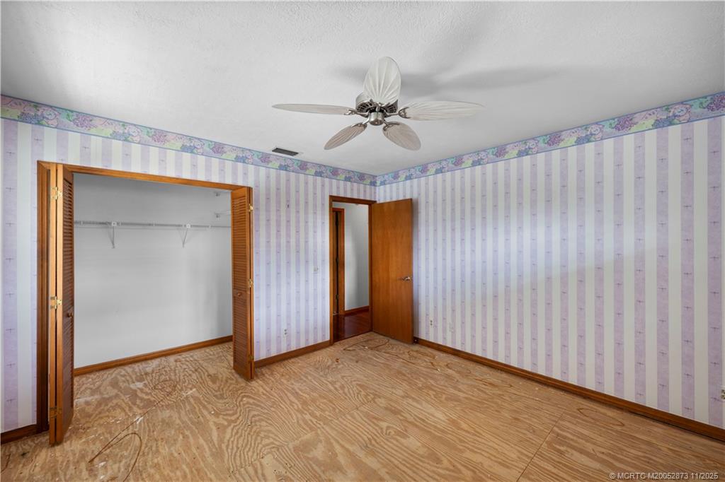 969 Southeast St Lucie Boulevard Stuart, FL 34996 - Photo 22 of 49 a view of a livingroom with a chandelier fan