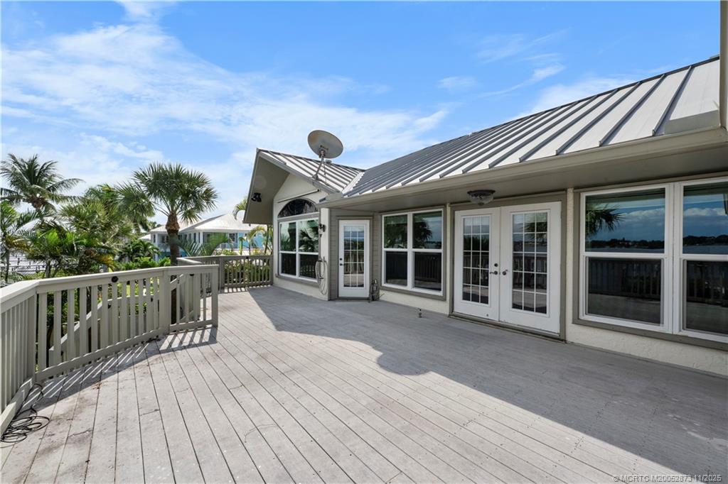 969 Southeast St Lucie Boulevard Stuart, FL 34996 - Photo 29 of 49 a view of a house with backyard and porch