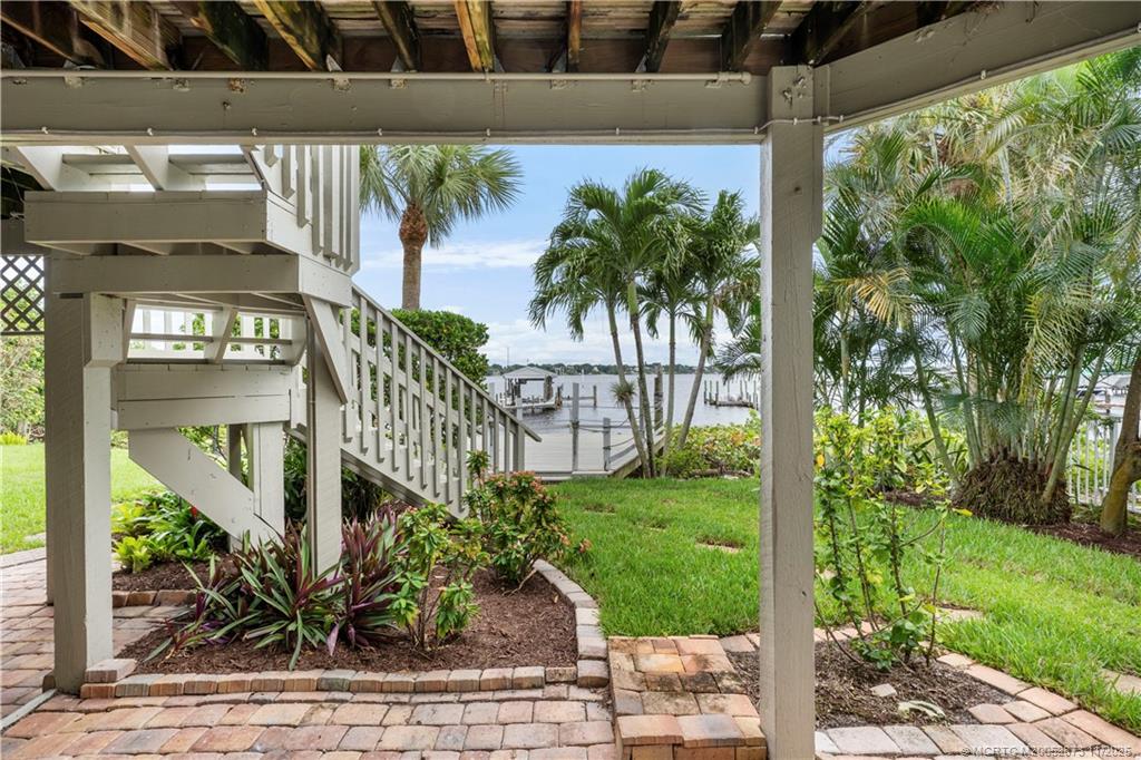969 Southeast St Lucie Boulevard Stuart, FL 34996 - Photo 35 of 49 a view of a house with a tree in front of it