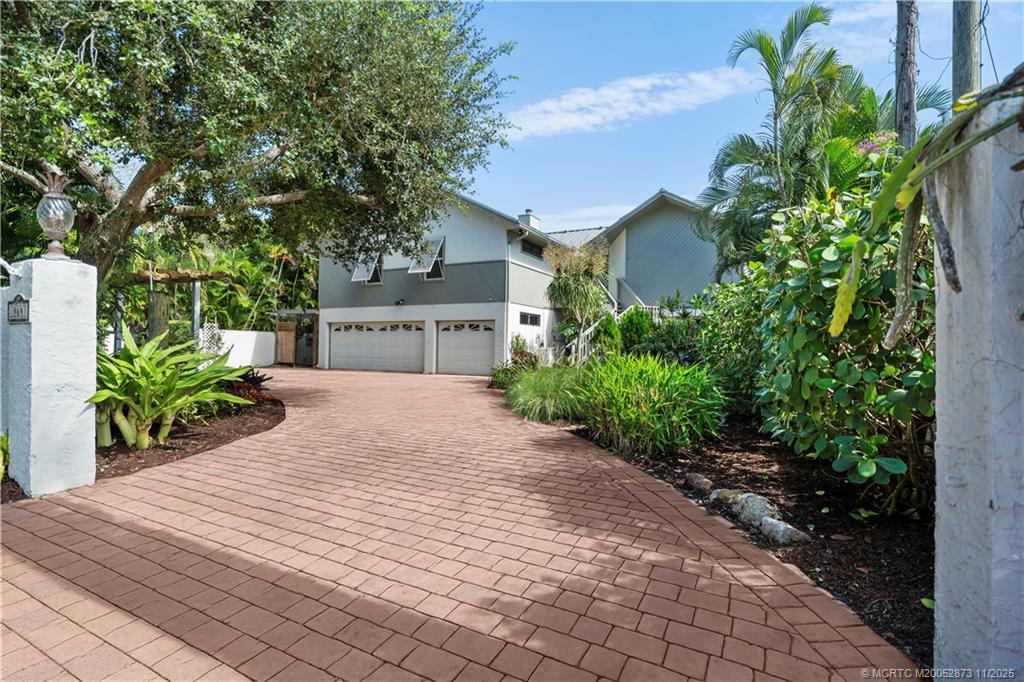 969 Southeast St Lucie Boulevard Stuart, FL 34996 - Photo 46 of 49 a view of a house with a yard and potted plants