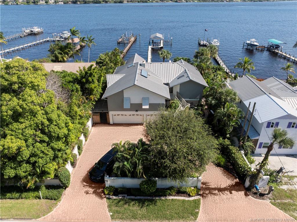 969 Southeast St Lucie Boulevard Stuart, FL 34996 - Photo 49 of 49 an aerial view of a house with a yard