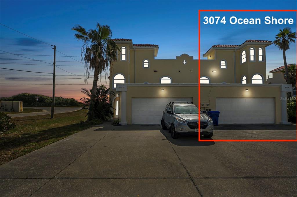 3074 Ocean Shore Boulevard Ormond Beach, FL 32176 - Photo 1 of 1 a car parked on the side of a road