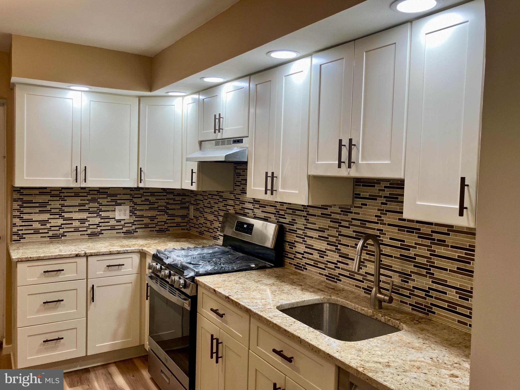 543 North Simpson Street Philadelphia, PA 19151 - Photo 5 of 11 Modern kitchen with sleek finishes.