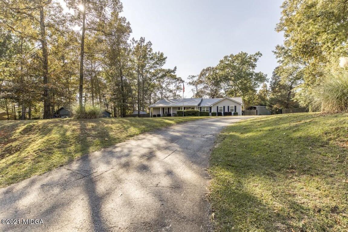 1471 Woolfolk Road Fort Valley, GA 31030 - Photo 2 of 51 a view of a yard with a tree