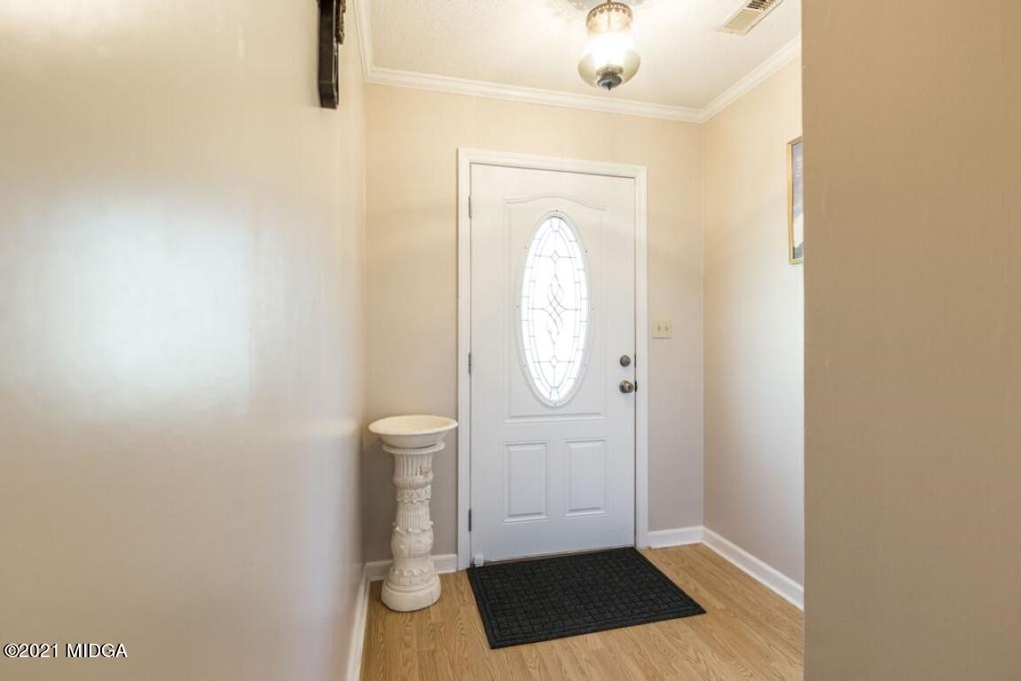 1471 Woolfolk Road Fort Valley, GA 31030 - Photo 11 of 51 a view of a bathroom with wooden floor