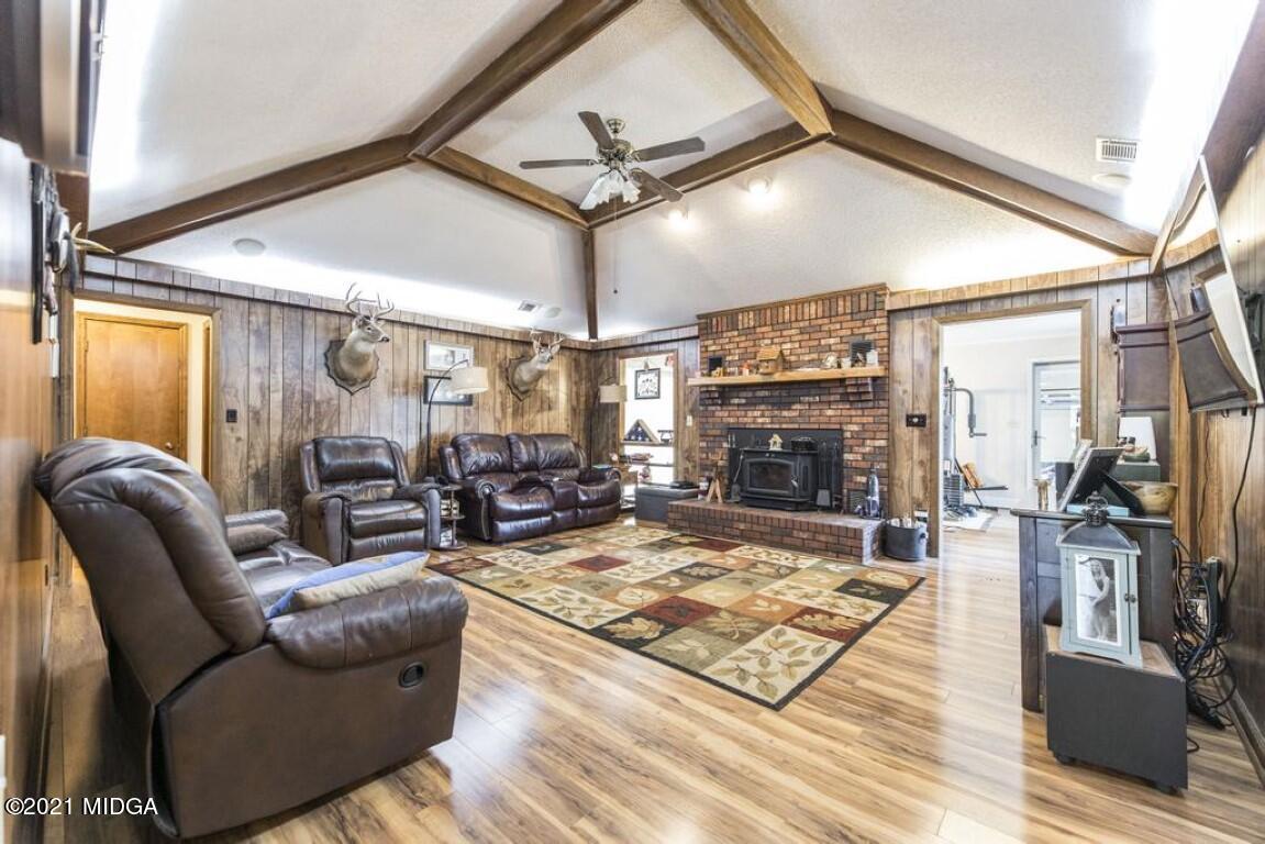 1471 Woolfolk Road Fort Valley, GA 31030 - Photo 12 of 51 a living room with furniture and a fireplace