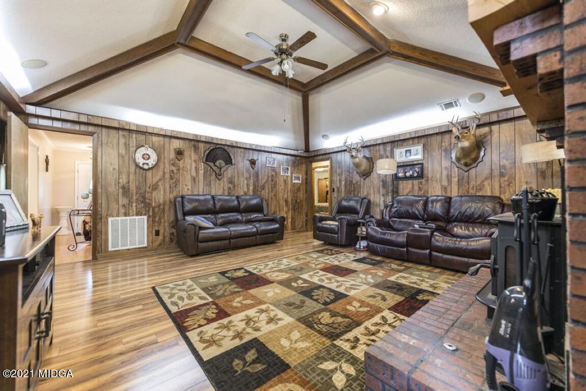 1471 Woolfolk Road Fort Valley, GA 31030 - Photo 14 of 51 a living room with lots of furniture and a rug
