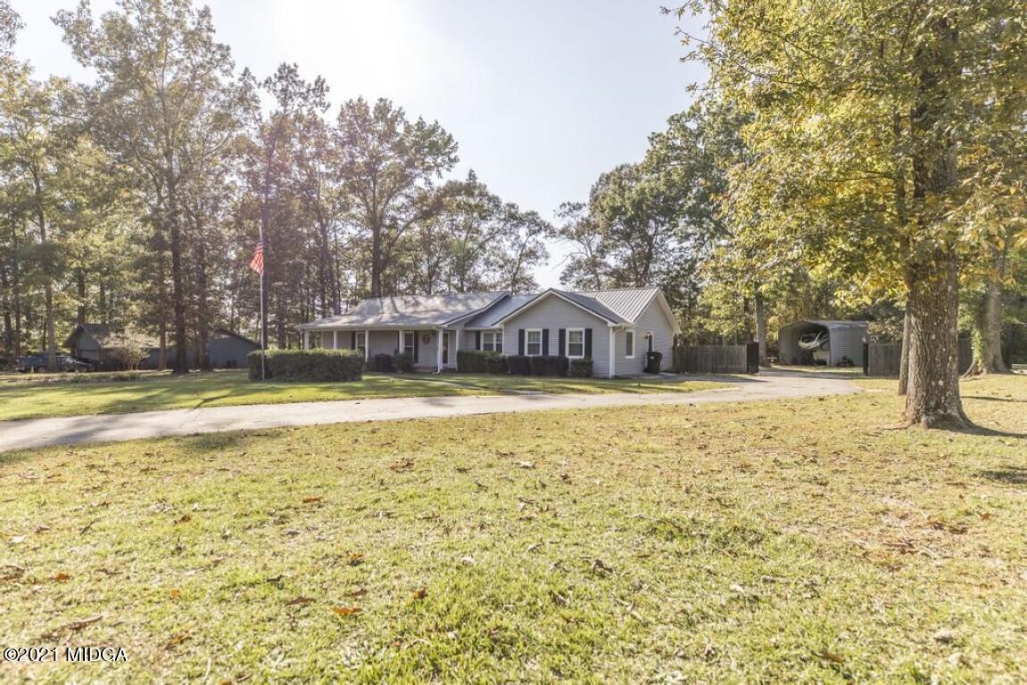 1471 Woolfolk Road Fort Valley, GA 31030 - Photo 5 of 51 a view of swimming pool with large trees