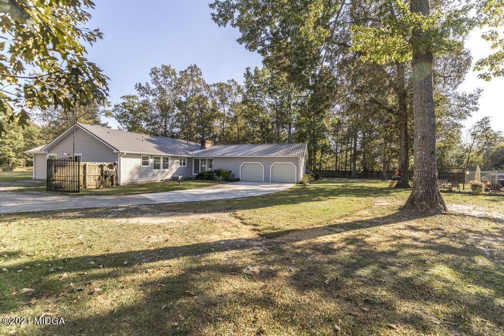 1471 Woolfolk Road Fort Valley, GA 31030 - Photo 47 of 51 a view of house with outdoor space and sitting area