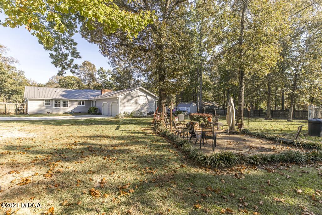 1471 Woolfolk Road Fort Valley, GA 31030 - Photo 48 of 51 a view of a house with a yard