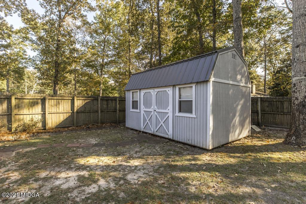 1471 Woolfolk Road Fort Valley, GA 31030 - Photo 50 of 51 a house view with a backyard space