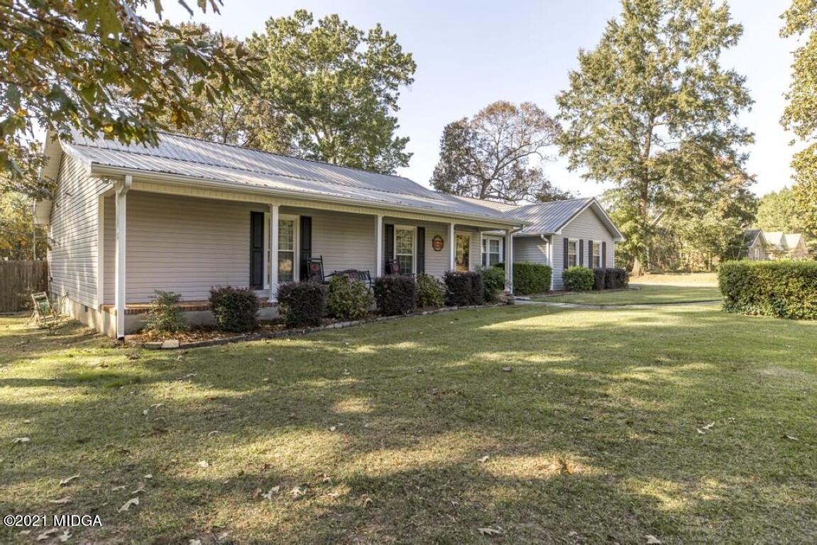 1471 Woolfolk Road Fort Valley, GA 31030 - Photo 7 of 51 a view of a house with backyard and sitting area