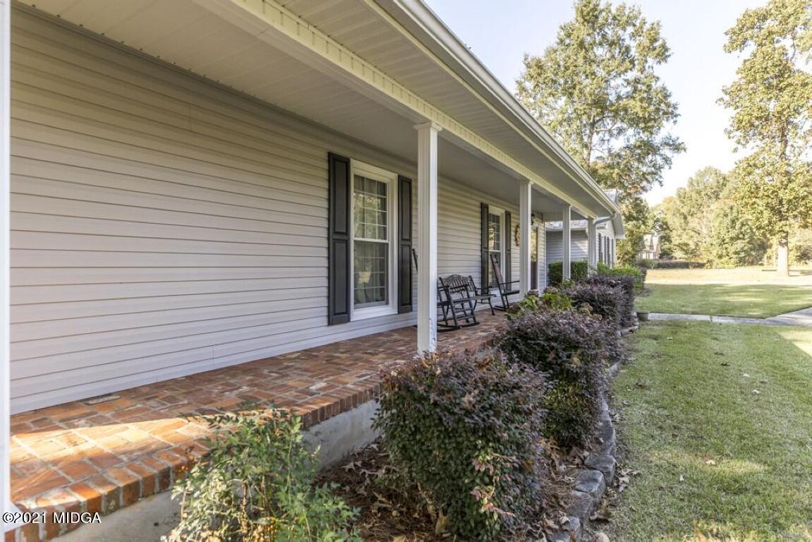 1471 Woolfolk Road Fort Valley, GA 31030 - Photo 8 of 51 a view of a house with backyard and garden