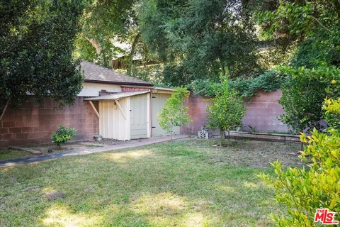 a view of a house with a tree