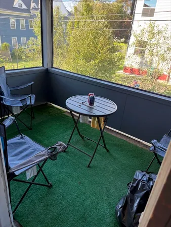 a view of a chairs and table in backyard