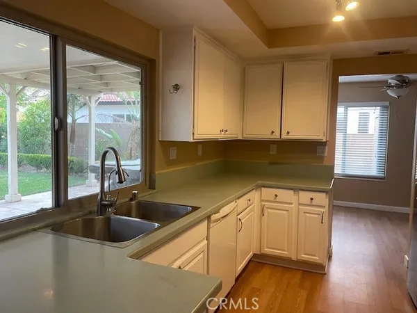 a kitchen with a sink and cabinets