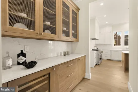 a kitchen with a sink cabinets and appliances