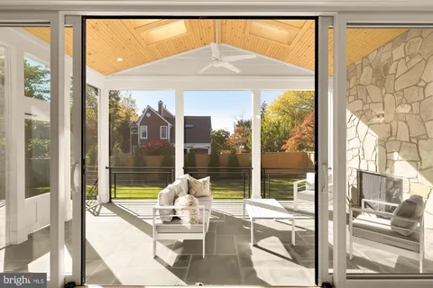 a living room with a large window and table