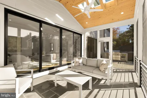 a living room with a large window and table