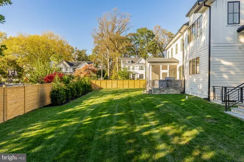 a view of a house with a yard porch and sitting area