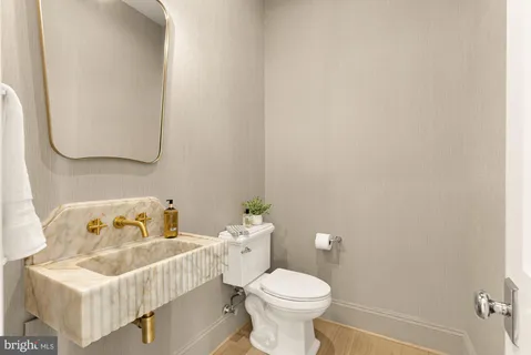 a view of staircase with white walls and a window