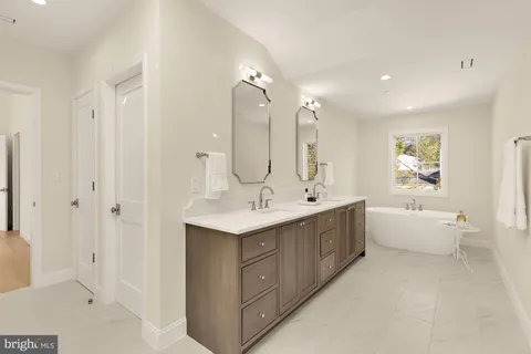a bathroom with a bathtub and shower
