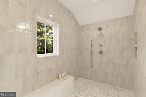 a bathroom with a shower and a sink