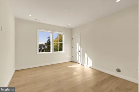 a bathroom with a double vanity sink mirror and bathtub