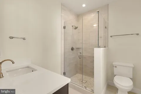 a kitchen with a sink cabinets and a window