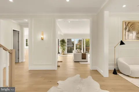 a view of a livingroom with furniture and floor to ceiling window