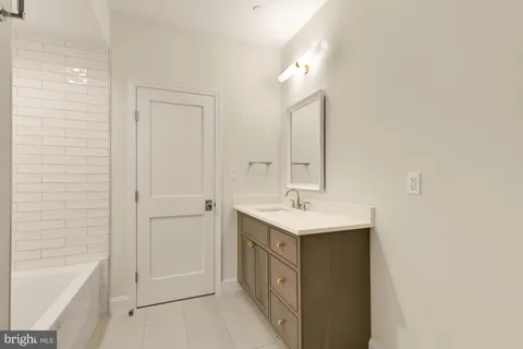 an empty room with a hard wood floor