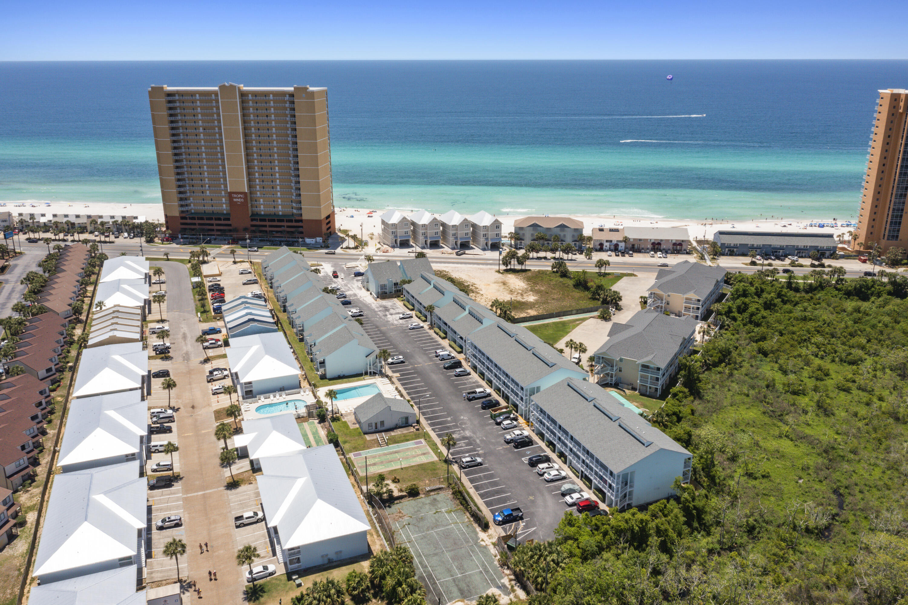an aerial view of residential houses with outdoor space