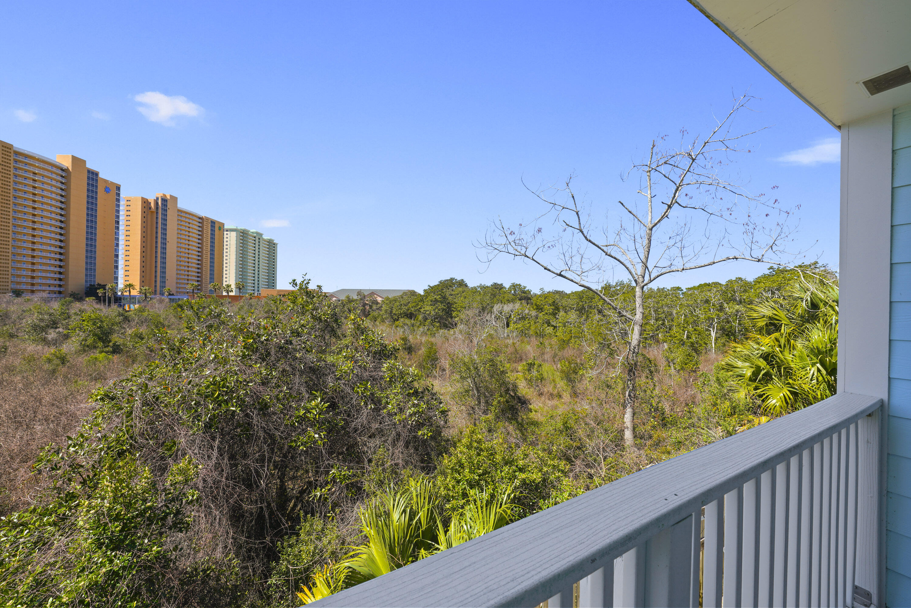 17670 Front Beach Road, Unit H9 Panama City Beach, FL 32413 - Photo 20 of 31 a view of a balcony with an outdoor space and seating
