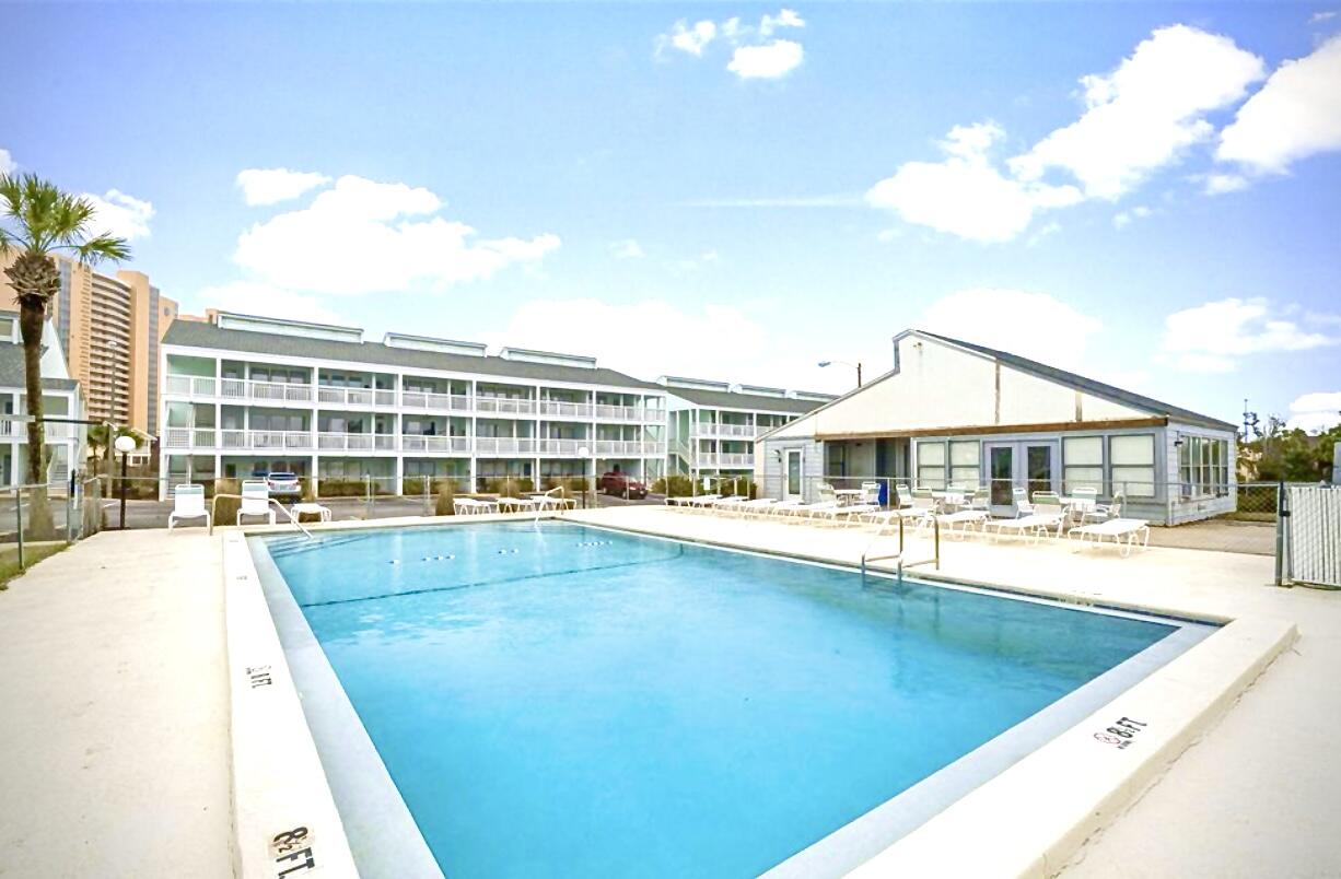 17670 Front Beach Road, Unit H9 Panama City Beach, FL 32413 - Photo 22 of 31 a view of a house with swimming pool and sitting area