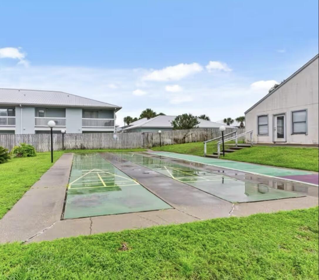 17670 Front Beach Road, Unit H9 Panama City Beach, FL 32413 - Photo 24 of 31 a view of backyard with swimming pool and green space
