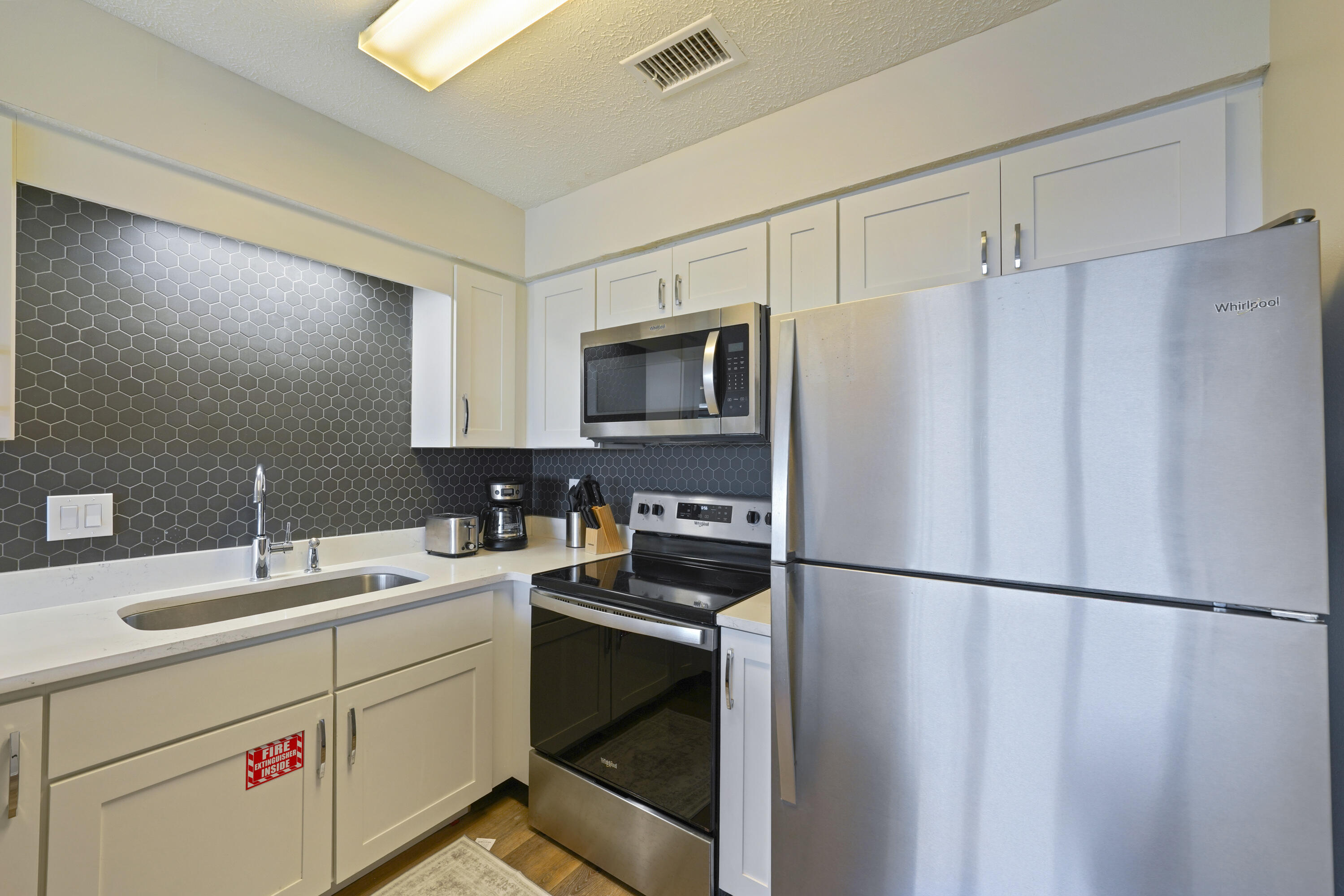 17670 Front Beach Road, Unit H9 Panama City Beach, FL 32413 - Photo 9 of 31 a utility room with dryer and washer
