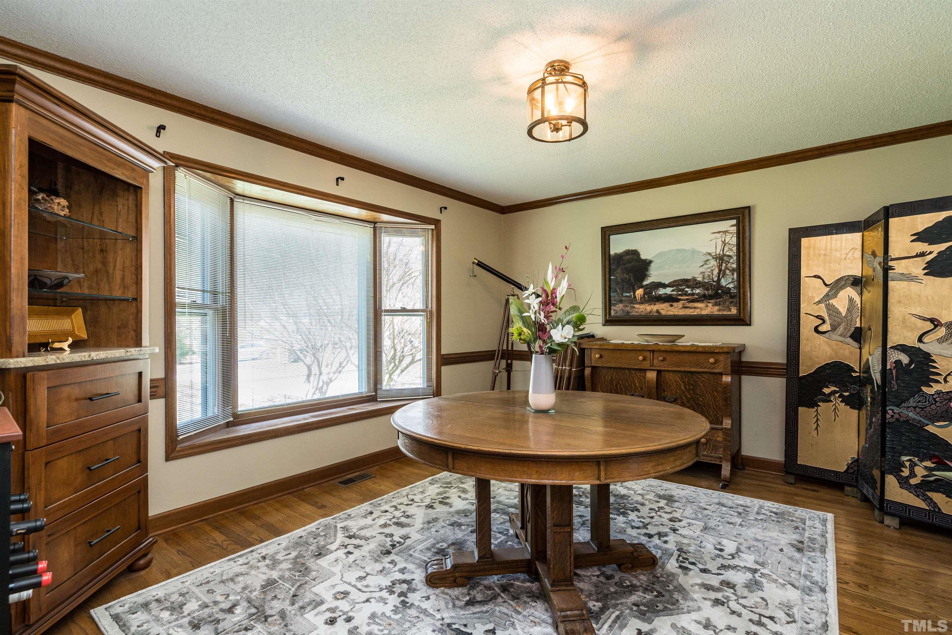 5929 Hampton Ridge Road Raleigh, NC 27603 - Photo 6 of 27 a living room with furniture and a table