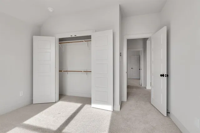 a view of a livingroom with a refrigerator
