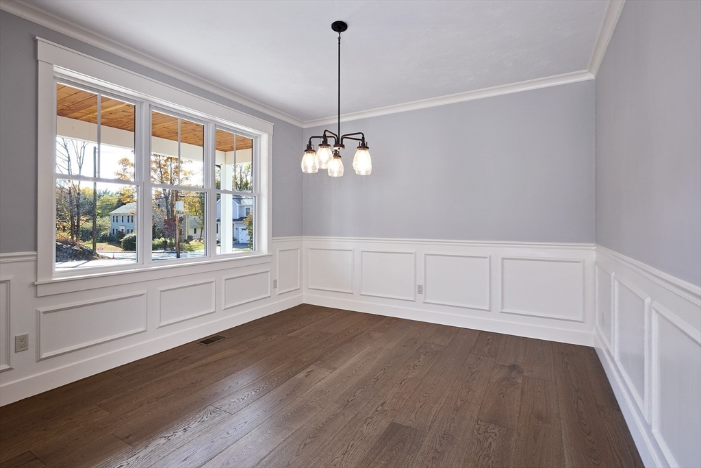 1 Thomas Drive Acton, MA 01720 - Photo 17 of 36 a view of a room with wooden floor and windows
